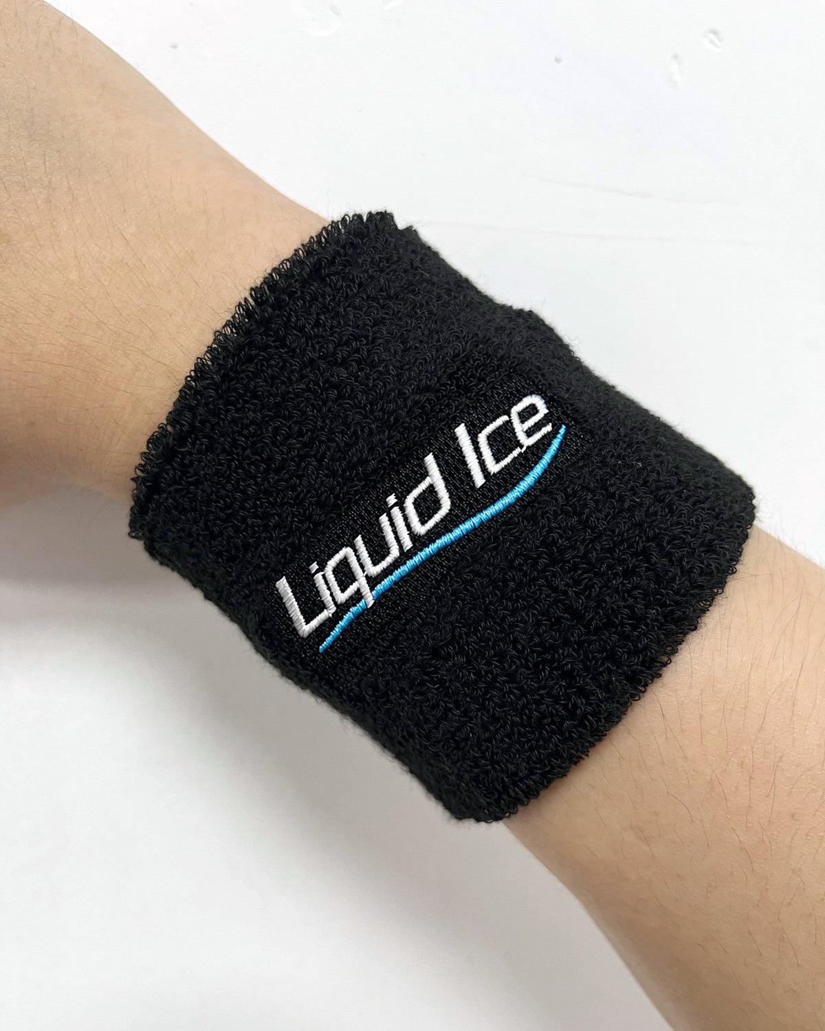 A Liquid Ice terry wristband on a wrist